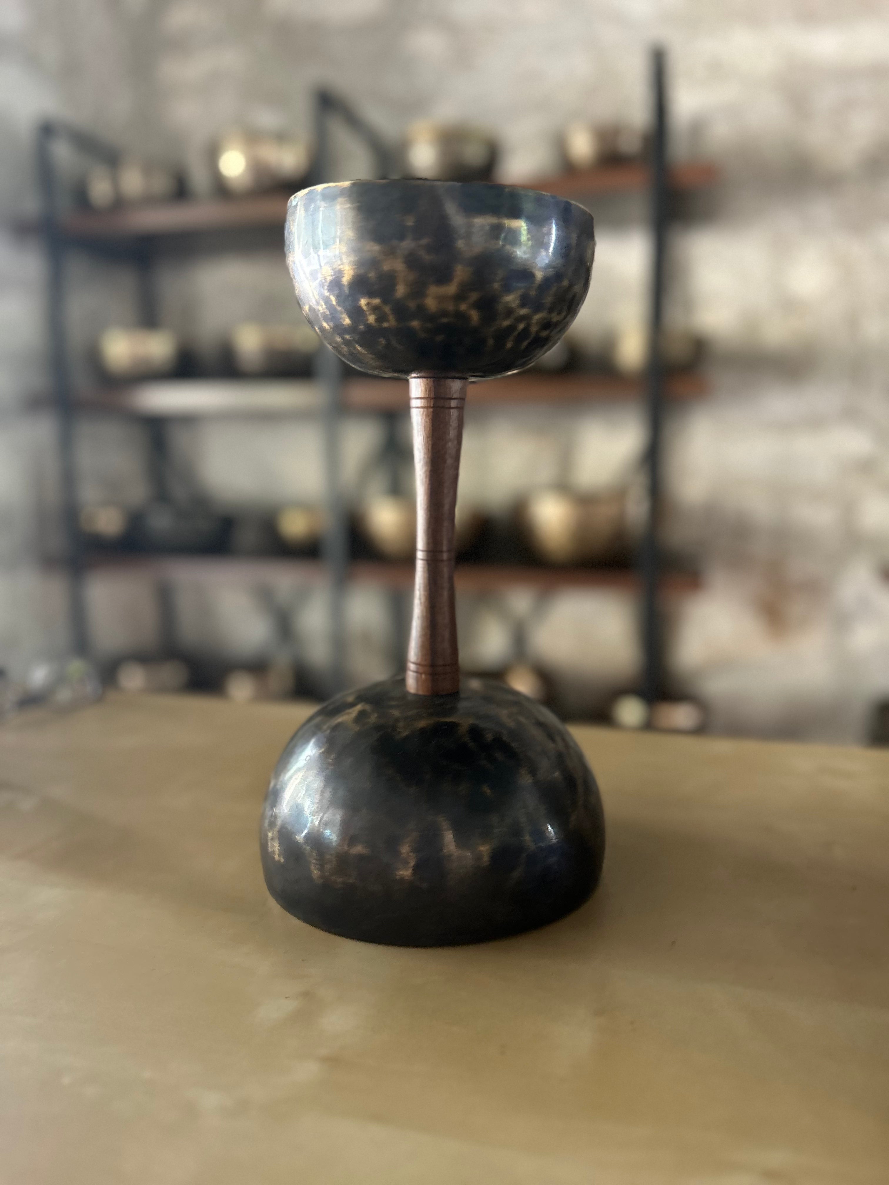 The Double Chalice Bowl — two singing bowls connected by a wooden dowel
