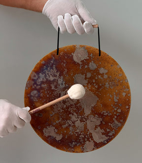Playing the Circle Gong Plate 11 inch with the felt mallet