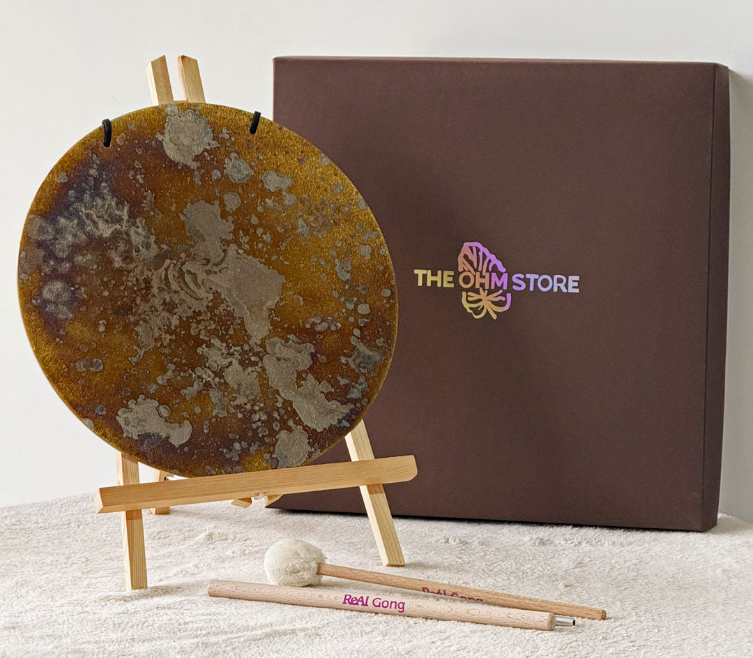 Circle Gong Plate 11 inch on an easel beside The Ohm Store presentation box